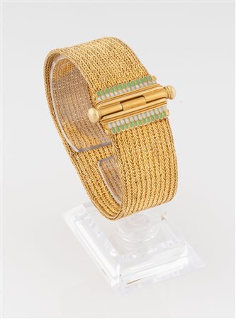 Braccialetto a maglia d'oro 18 kt e piccoli smalti. 1940 ca.