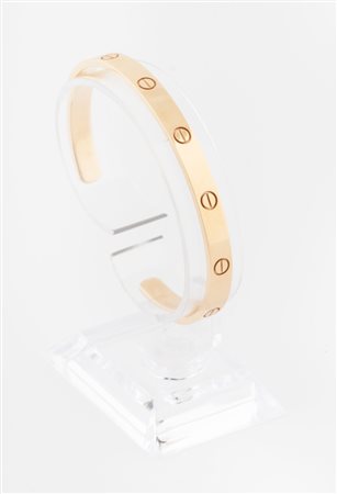 Cartier, Paris, Bracciale rigido Love modello aperto in oro 18 kt. 1970 e sgg.