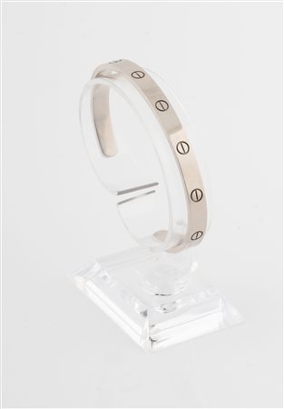 Cartier, Paris, Bracciale rigido Love modello aperto in oro bianco 18 kt. 1970 e sgg.
