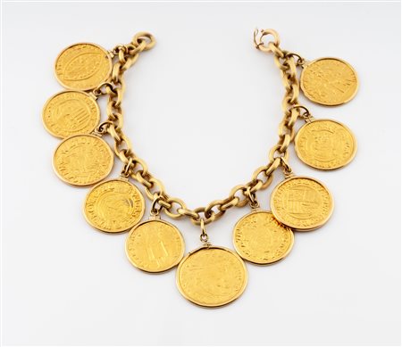 Bracciale in oro giallo 18 kt con dieci monete in oro. 1980 ca.