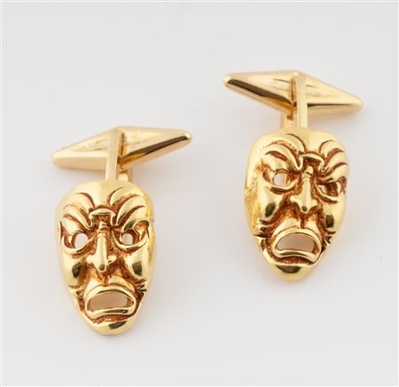 Gemelli in oro giallo 18 kt con maschere. 1980 ca.