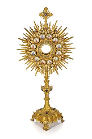 Grande ostensorio a raggiera in metallo e bronzo dorati con placche in smalti...