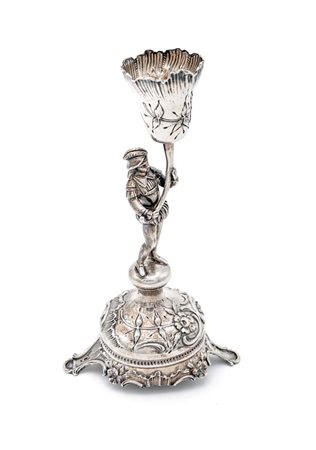 Porta candela in argento a forma di fiore sorretto da figura di paggio, XIX...