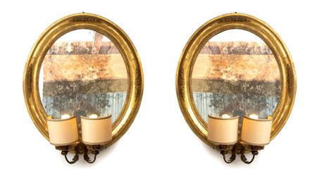  
Coppia di specchiere ovali italiane XIX secolo
 Altezza x larghezza: 65 x 50 cm.