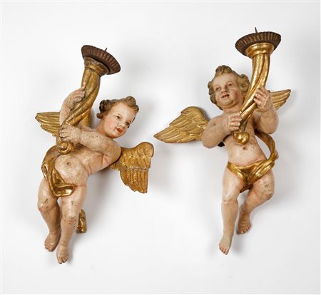  
Coppia di putti reggicero 
 Cm 40x27x17