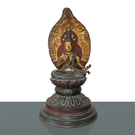 Buddha in bronzo brunito con parti dorate