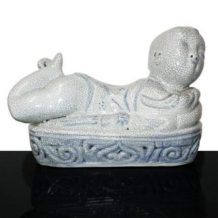Scaldino in ceramica dalle fattezze di bambino