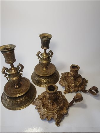 Coppia di candelieri bulinati e coppia di candelieri barocchetto