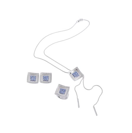  - Elegante parure composta da collana con saliscendi e orecchini  in oro bianco 18k con zaffiri blu e diamanti .