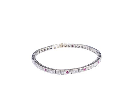  - Bracciale tennis in oro bianco 18k con diamanti e rubini .
