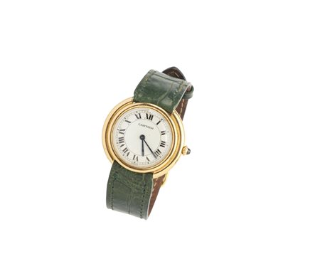 CARTIER - Orologio in oro giallo 18k con cassa tonda e cinturino in pelle verde.