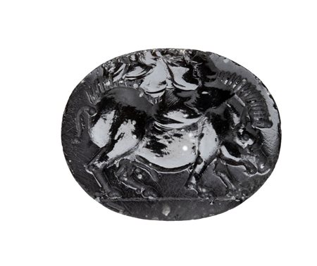 A large italic obsidian intaglio. Boar.