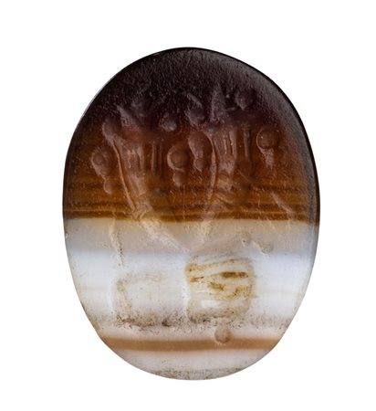 An Italic banded agate intaglio. Hand holding two cornucopias.