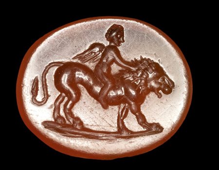 A Roman carnelian intaglio. Eros on a lion.