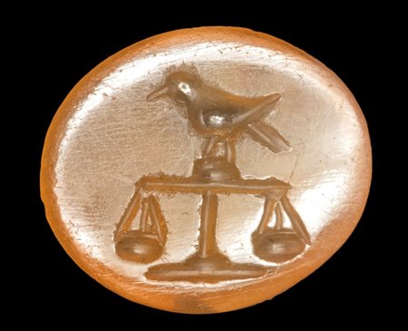 A Roman carnelian intaglio. Bird on a scale.