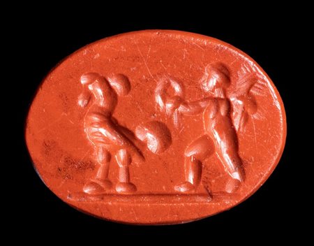 A Roman red jasper intaglio. Winged eros with rooster.