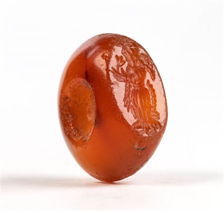 A Sasanian carnelian stamp seal. Woman with a flower.
