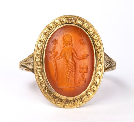 A Roman carnelian intaglio set in a later gold ring. Votive scene.