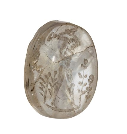 An Egyptian Late Period rock crystal scaraboid engraved in a later period. Rural scene