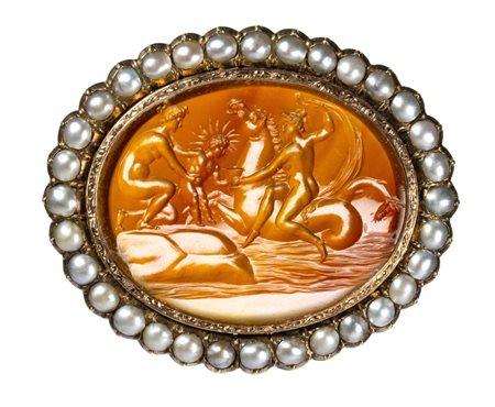 A fine Neoclassical carnelian intaglio set in a gold chiseled brooch with pearls. Mythological scene.