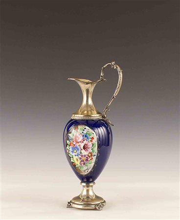 Versatoio in porcellana policroma e argento, vecchia manifattura, h. cm. 34.