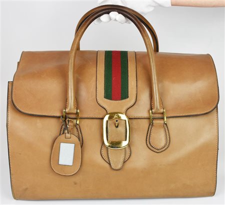 Gucci VINTAGE LEATHER SUITCASE DESCRIPTION: Leather suitcase with Web motif...