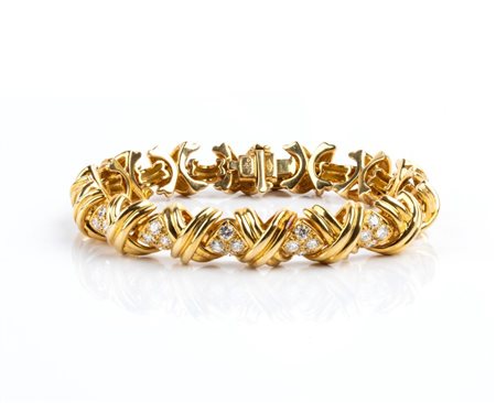 TIFFANY & CO.®  
Collezione: "Signature X". Bracciale in oro giallo e diamanti 
 