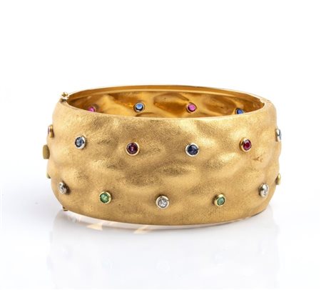  
Bracciale a fascia in oro con pietre preziose Anni '80
 