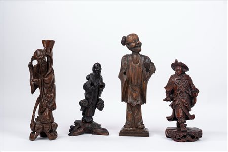 Lotto composto da quattro figure orientali in legno scolpito. Cina, secolo XX