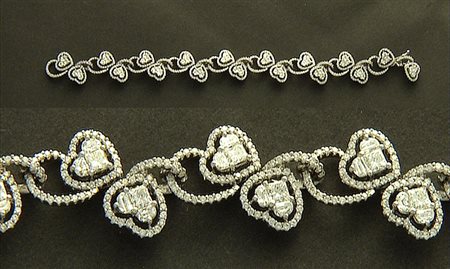 BRACCIALE BRACCIALE. In oro bianco 18 kt maglie a volute alternate a cuori...
