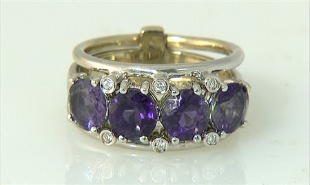 ANELLO ANELLO. In oro bianco 18 kt al centro motivo a quattro ametiste taglio...