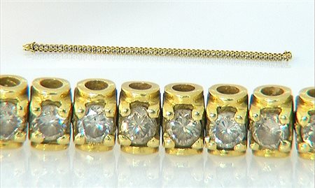 BRACCIALE BRACCIALE TENNIS. In oro giallo 18 kt a maglie cilindriche...