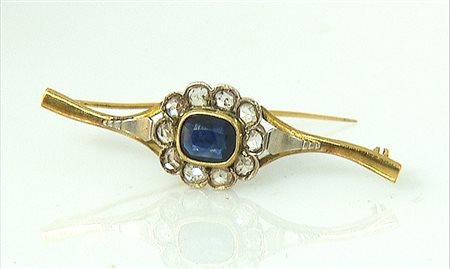 SPILLA SPILLA INIZIO XX SECOLO. In oro 18 kt ed argento realizzata a fiore...