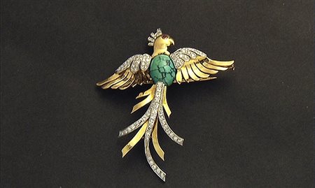 SPILLA SPILLA ANNI '60 CA. In oro giallo 18 kt e platino raffigurante fenice...