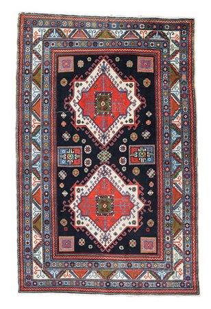 Tappeto Kazak, Caucaso, secolo XX. Decoro con due medaglioni stellari nei toni