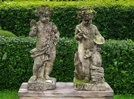 Due sculture da giardino raffiguranti putti allegorici allusivi alle arti della
