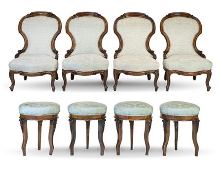Lotto composto da quattro poltrone in noce filettato in ottone unite a quattro