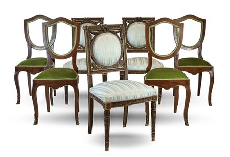 Lotto composto da un gruppo di quattro sedie con schienali a giorno a forma di