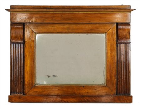 Caminiera in noce con specchio entro lesene scanalate. Secolo XIX (cm 84x107) (