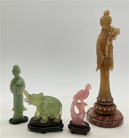 Lotto composto da quattro diverse sculture orientali in pietra dura tra cui una