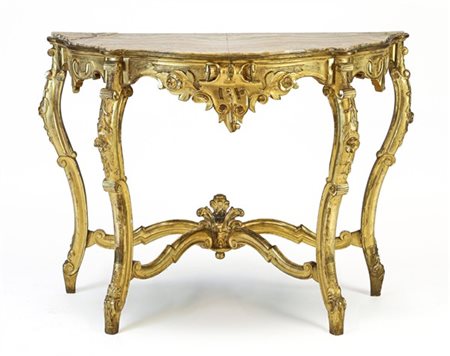 Console in legno intagliato e dorato con gambe mosse e crociera di raccordo a v