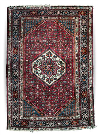 Tappeto Mossul, Persia, secolo XX. Decoro con medaglione esagonale a fondo bian