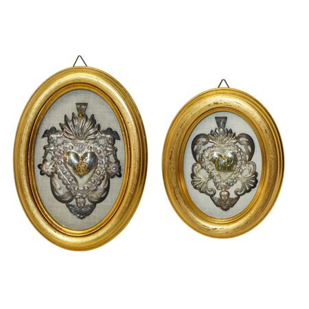 Coppia Ex Voto in argento in cornice ovale dorata
