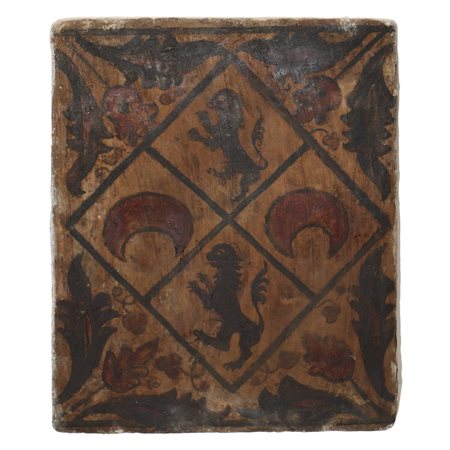 Placca Socarrat Valenziano  in argilla cotta raffigurante leoni araldici, lune e fiori.