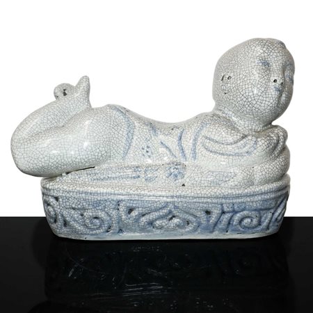 Scaldino in ceramica dalle fattezze di bambino