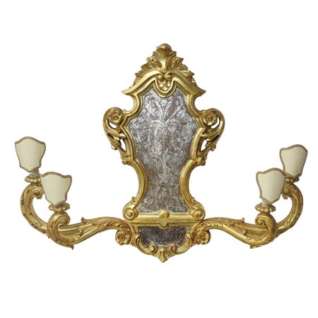 Fregio con bracci e candele in legno dorato, al centro foglia d'argento bulinata a motivi floreali , 19th/20th century