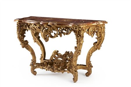 Console di forma mossa in legno intagliato, traforato e dorato riccamente decor