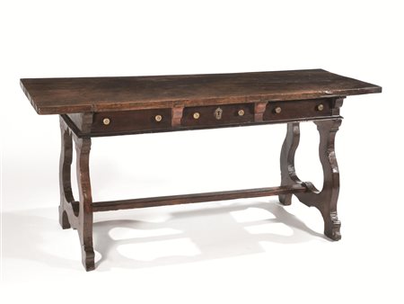 Tavolo, Emilia, metà sec. XVII, in noce a patina scura, piano rettangolare...