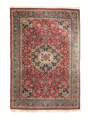 TAPPETO PERSIANO KESHAN, INIZI SECOLO XXfondo rosso con decori floreali...