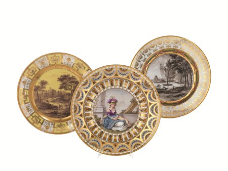 TRE PIATTI, FRANCIA SECOLO XIXin porcellana policroma, due piatti con cavetti...